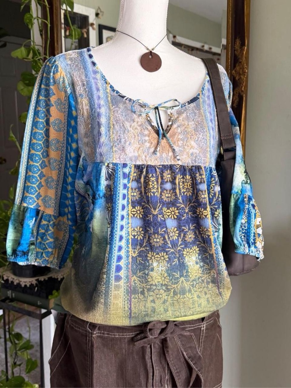 Whimsical One World blouse with earth tones